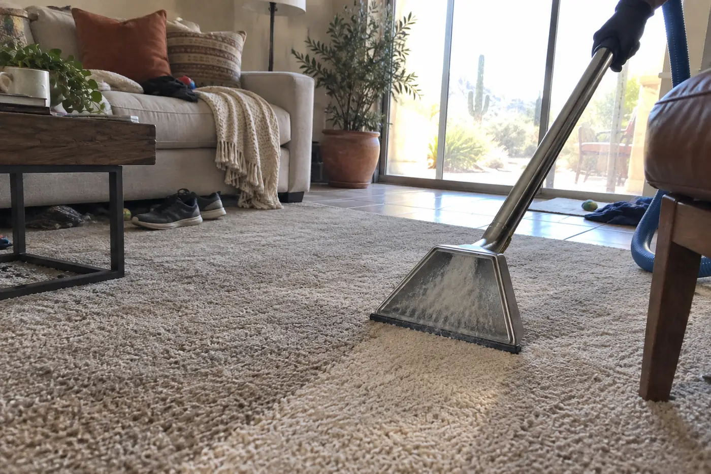 Carpet cleaner refreshing a light carpet in a Phoenix-area living room
