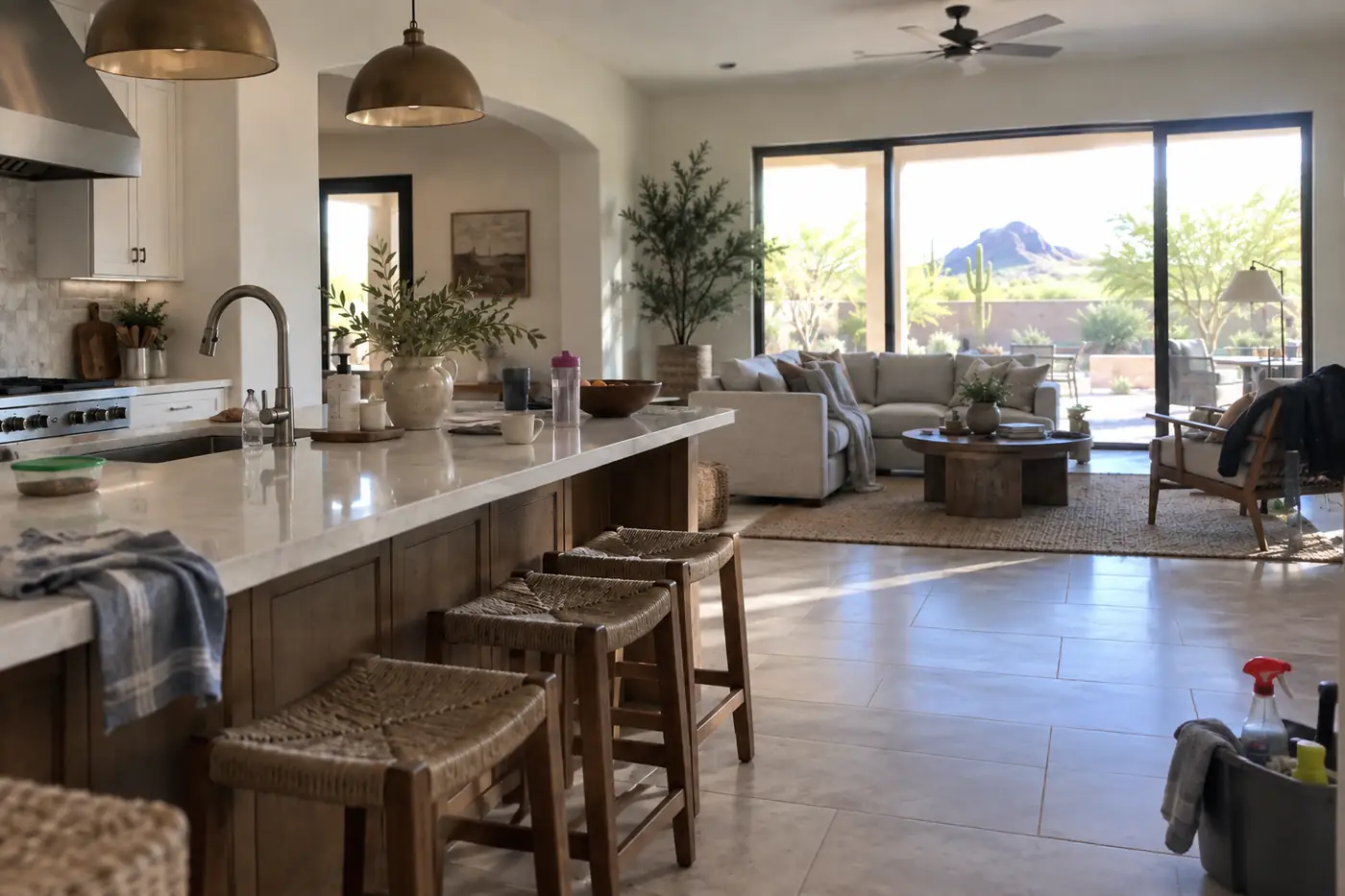 Professional house cleaner wiping a bright Southwest-style kitchen for a Phoenix metro home